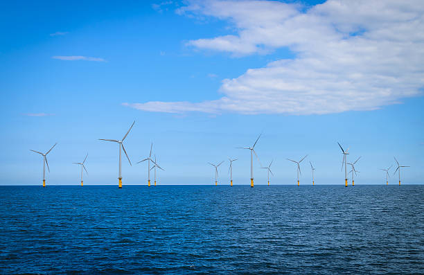 turbina a vento in mare aperto windfarm - offshore wind foto e immagini stock