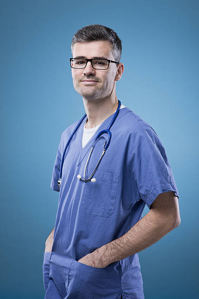 istock Smiling doctor posing and smiling at camera 485862578