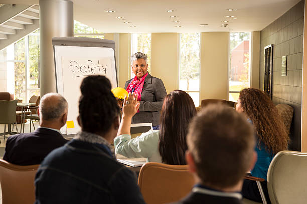 istock Safety in the workplace. Presentation with office workers. 485862643
