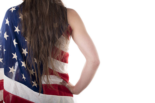 istock young woman dressed with an American flag 485863867