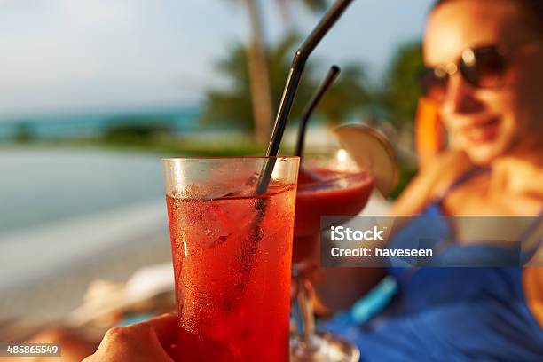 Couple Clinking Glasses With Cocktails Stock Photo - Download Image Now - Cocktail, Swimming Pool, Adult