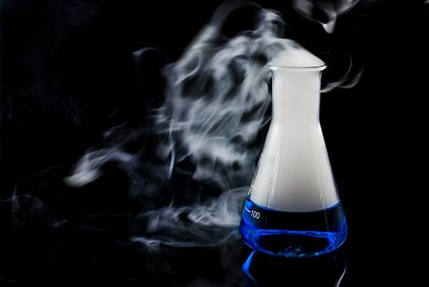 istock glas with a blue liquid used for chemical analysis 485865642