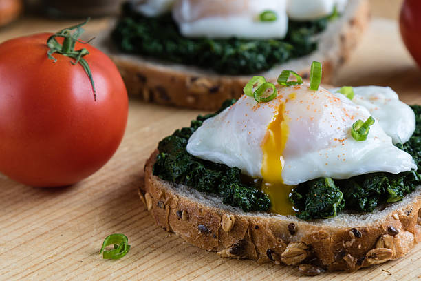 spinach and poached egg on brown bread