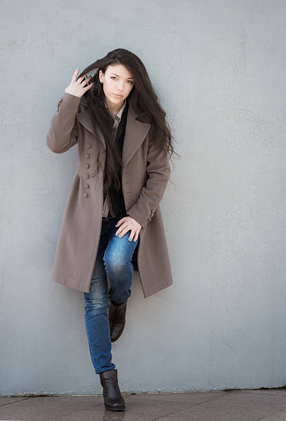 istock Young girl in coat. 485868361