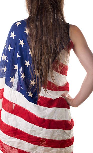 istock young woman dressed with an American flag 485869565