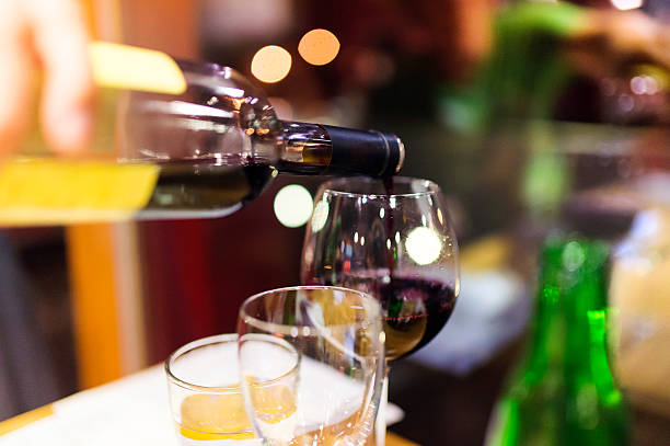 istock Pouring red wine into the glass 485869994