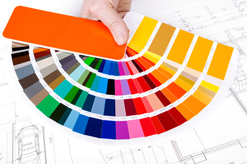 Color Swatch for home improvement with blueprints of house plan  