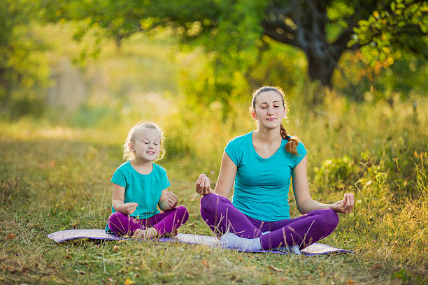istock Mom and child in the lotus position 485870096