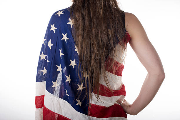 istock young woman dressed with an American flag 485870491