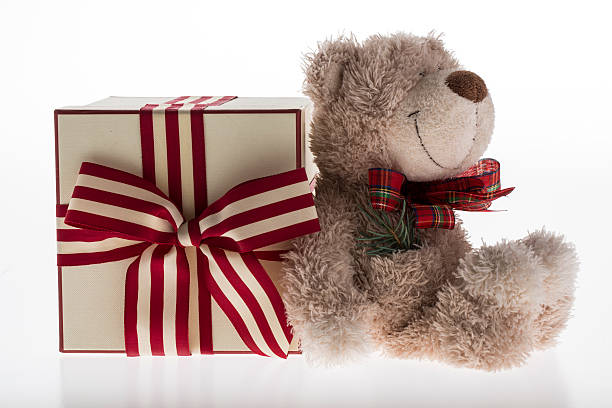 istock teddy bear with christmas decoration on white background 485870778