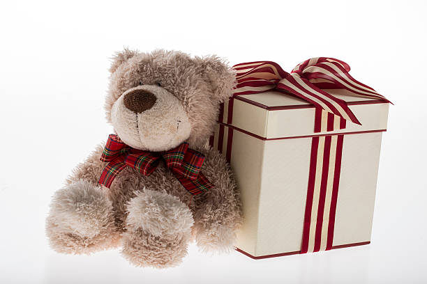 istock teddy bear with christmas decoration on white background 485871608