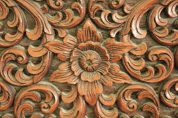 istock Carved wooden flowers ,background 485873228