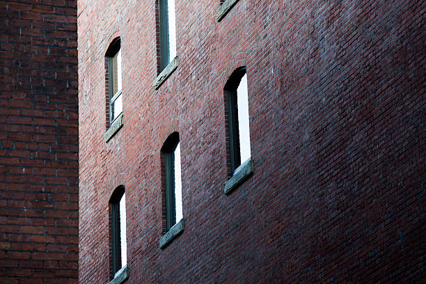 istock windows on the wall of brick - Stock Image 485873432