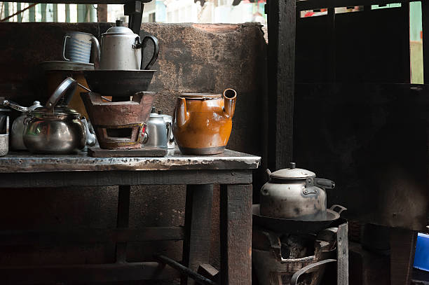istock Cearmic coal stove with the metallic and ceramic pots 485877618