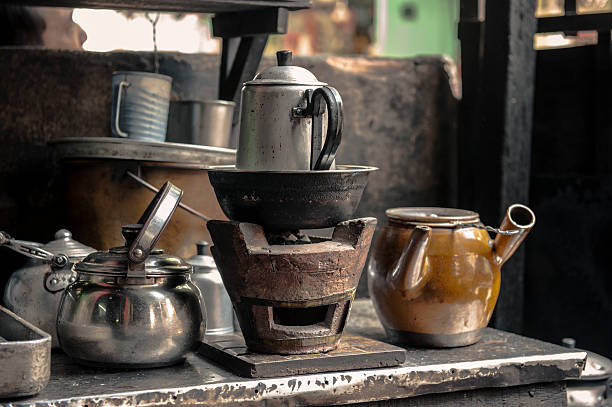 istock Cearmic coal stove with the metallic and ceramic pots 485877836