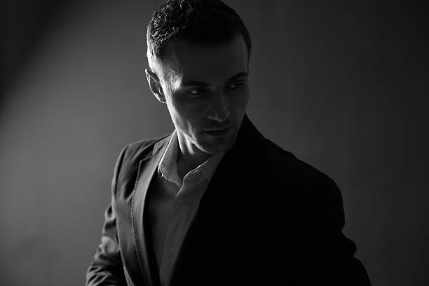istock pensive fashion man looking away 485878091
