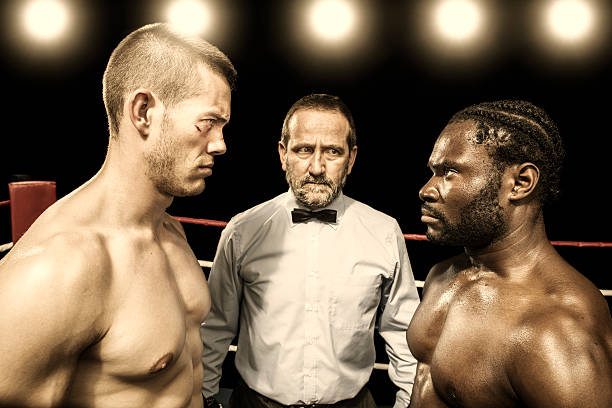 Boxing combat Two boxers look at each other at the beginning of the fight boxing referee stock pictures, royalty-free photos & images