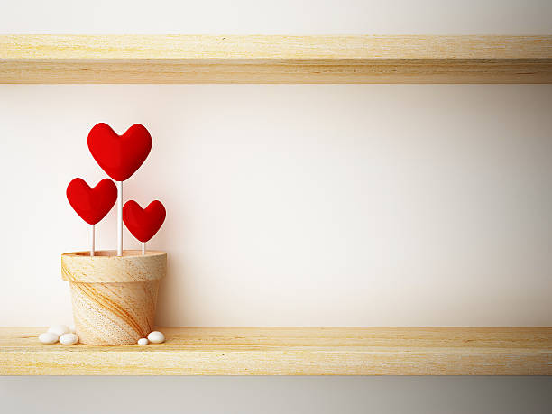 istock read heart in flower pot on wood shelf 485878199
