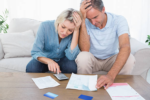 istock Worried couple going over finances 485878495