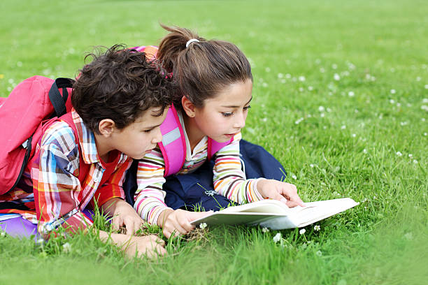 istock Kids reading outdoor 485880679
