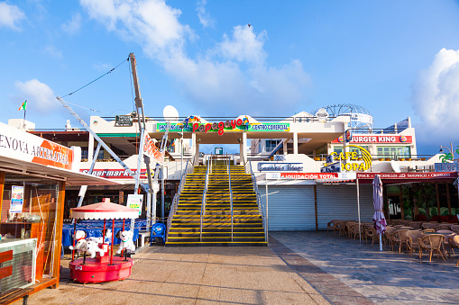 Playa Blanca, Spain - April 3, 2012:  early morning view to the shopping center Papagayo in Playa Blanca, Spain. The shopping center opened in 2002 and offers food,electronics and medical services.