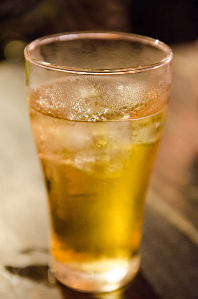 istock Glass of light beer on wood table 485881797