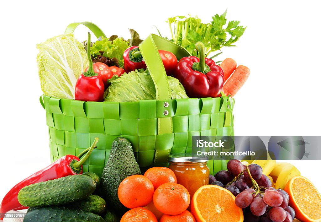 Green shopping bag with groceries isolated on white Green shopping bag with groceries isolated on white background Antioxidant Stock Photo