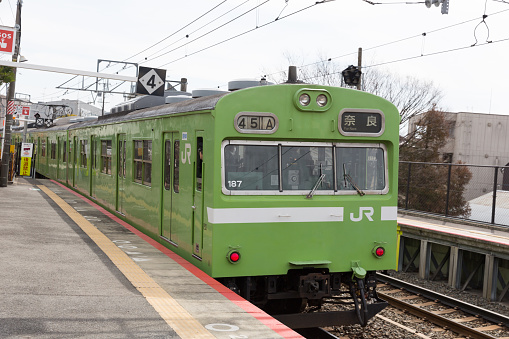 Kyoto, Japan - March 4, 2014 : Nara Line Train at the Inari Station in Kyoto, Japan. It is operated by the JR West. 