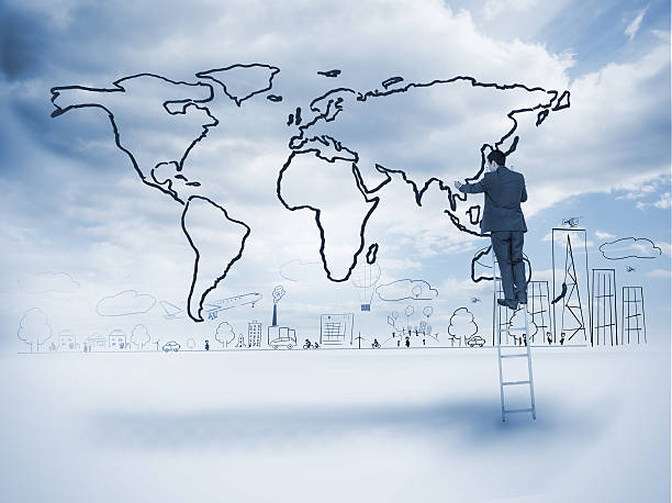 istock Businessman on ladder drawing a map 485885651