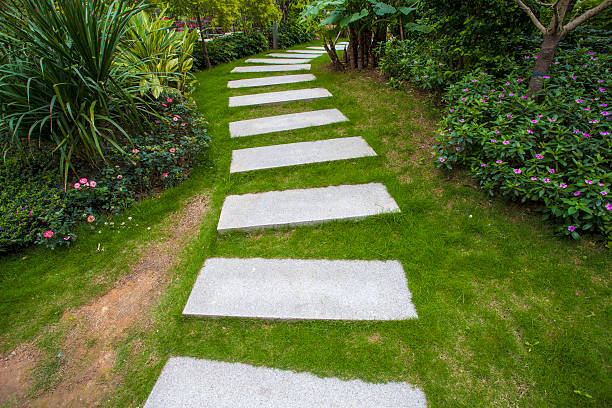 istock Stone walkway winding its way through tranquil garden 485885871