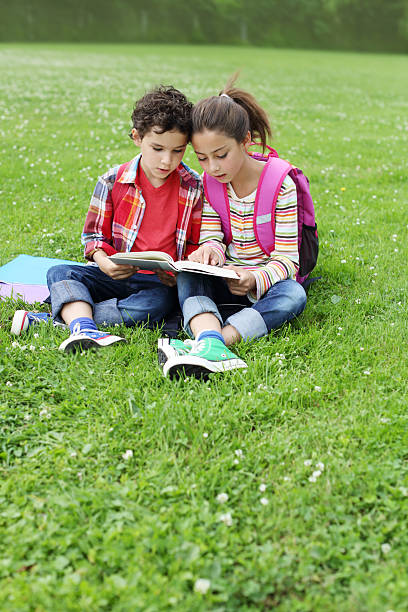 istock Kids reading outdoor 485885995