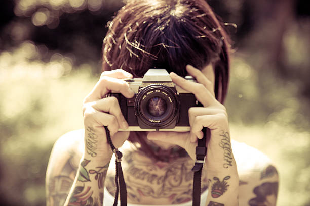 istock Beautiful young woman with photo camera 485886183