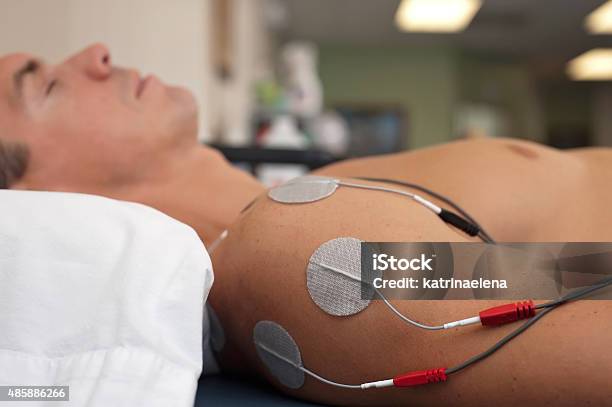 Shoulder Electrical Stimulation Tens Stock Photo - Download Image Now - 2015, Adult, Alternative Therapy
