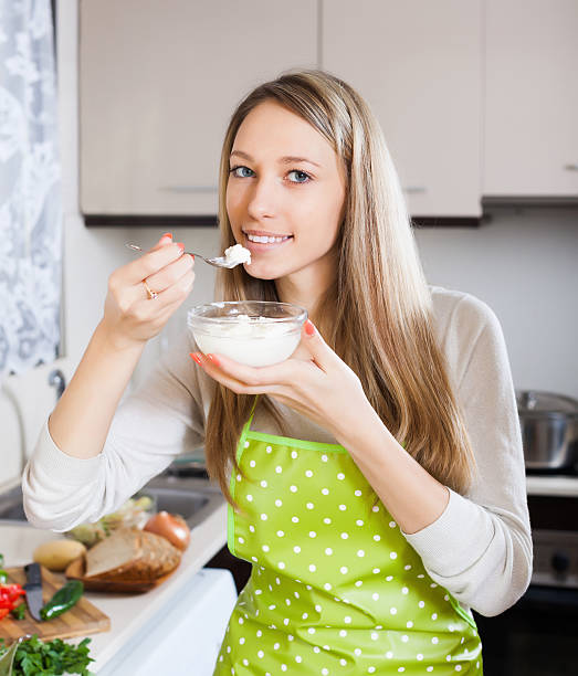istock Happy woman eating cottage cheese 485886341