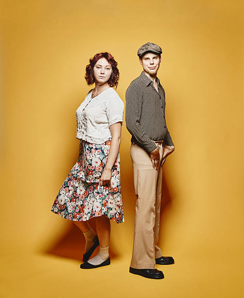 Couple and 70's look theme Couple and 70's look theme, yellow background 70s theme stock pictures, royalty-free photos & images