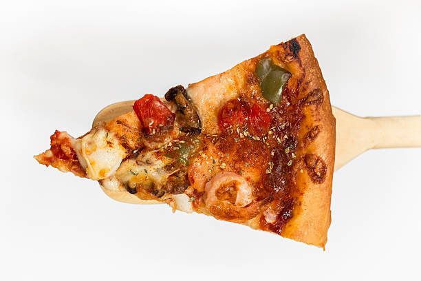 Slice of fresh homemade seafood pizza stock photo