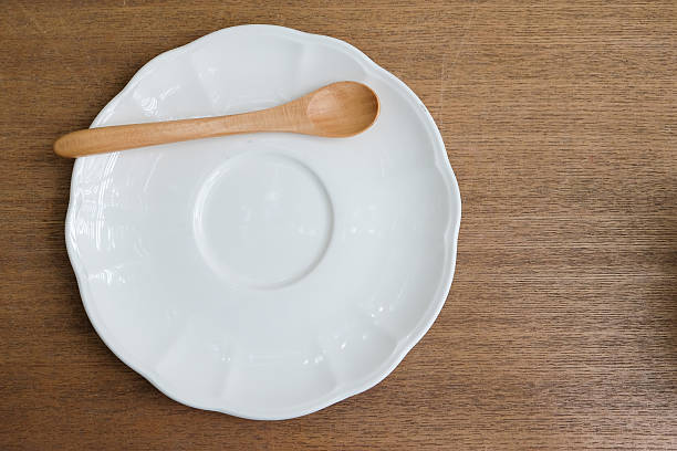 istock Empty dish color white  with wood fork and wood spoon 485888386