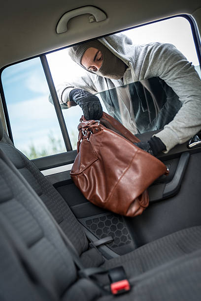 istock Thief stealing a purse from the car 485888756