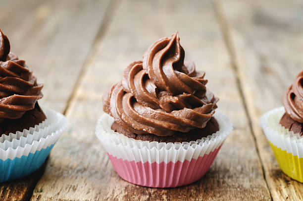 istock chocolate cupcakes with chocolate frosting 485890036
