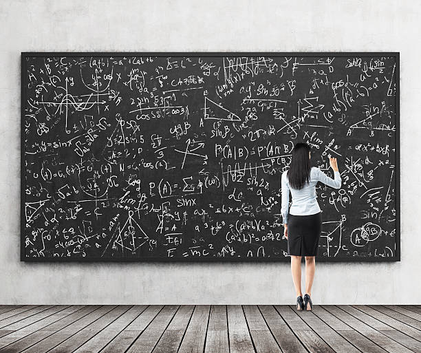 istock brunette girl who is writing down math formulas 485890054