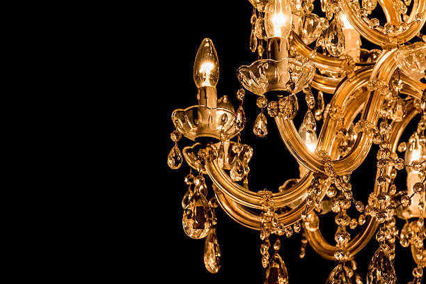 istock Gallant chandelier with light candles and dark side background 485890736