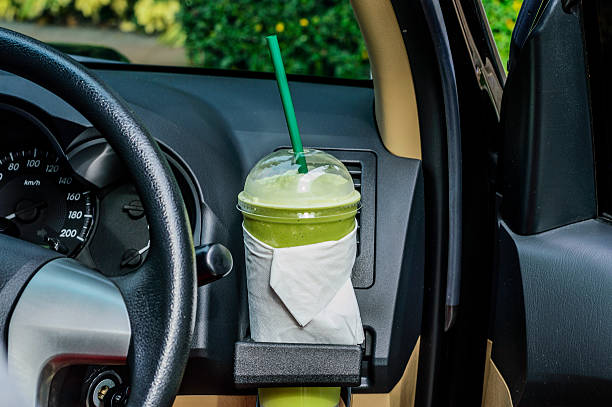 istock Bottle with the green tea in a car interior 485890760