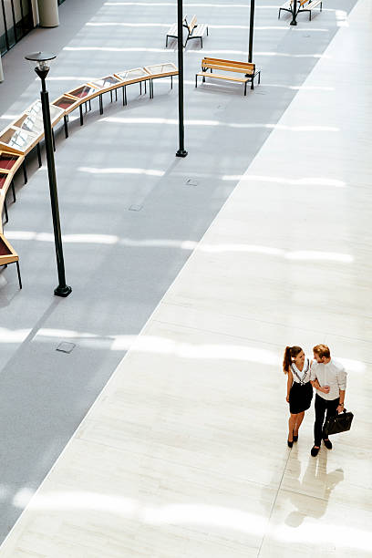 istock Business couple walking together 485891316