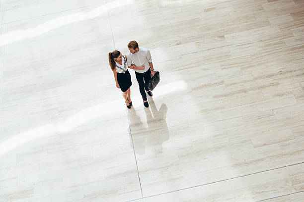 istock Business couple walking together 485891630