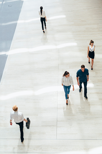 Young business people before starting work in their office