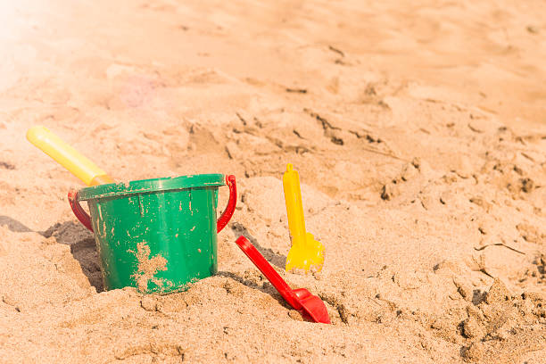 istock kids toys on tropical sand beach 485894182