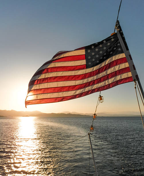 American Flag Backlit by the Sunset stock photo