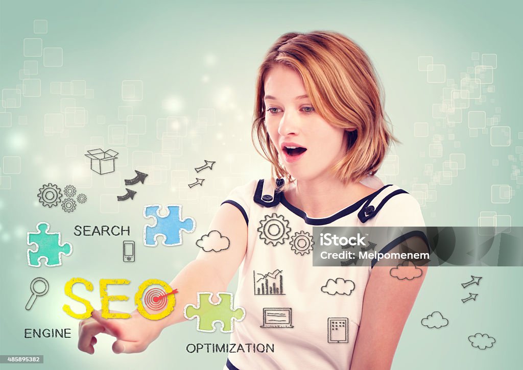 Woman activating an SEO interface Pretty young woman activating an SEO interface on a virtual screen with scattered SEO icons for optimizing a website Improvement Stock Photo