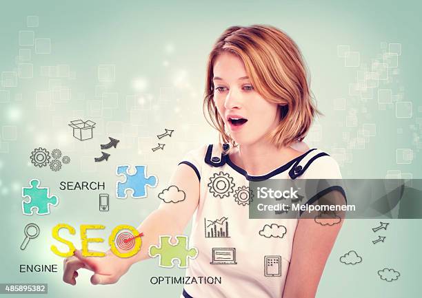 Woman Activating An Seo Interface Stock Photo - Download Image Now - Improvement, Search Engine, 2015