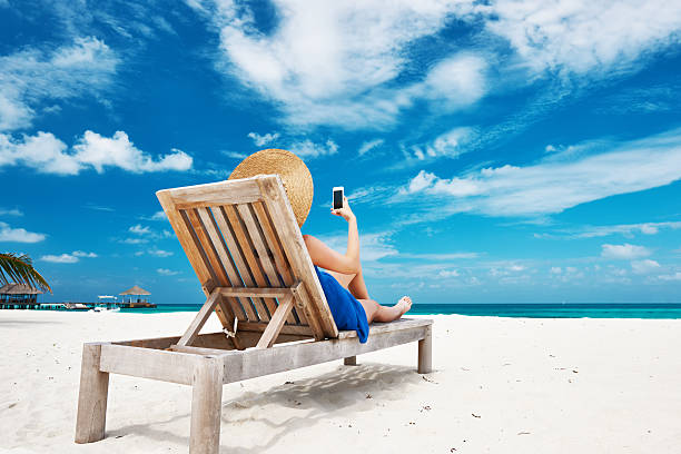 istock Young woman with tablet pc at the beach 485895393